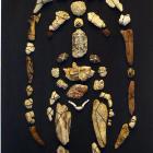Preistorica, 2012  -150x50 cm - Sassi, creta, legni, pietra lavica, ossa cucite su tela